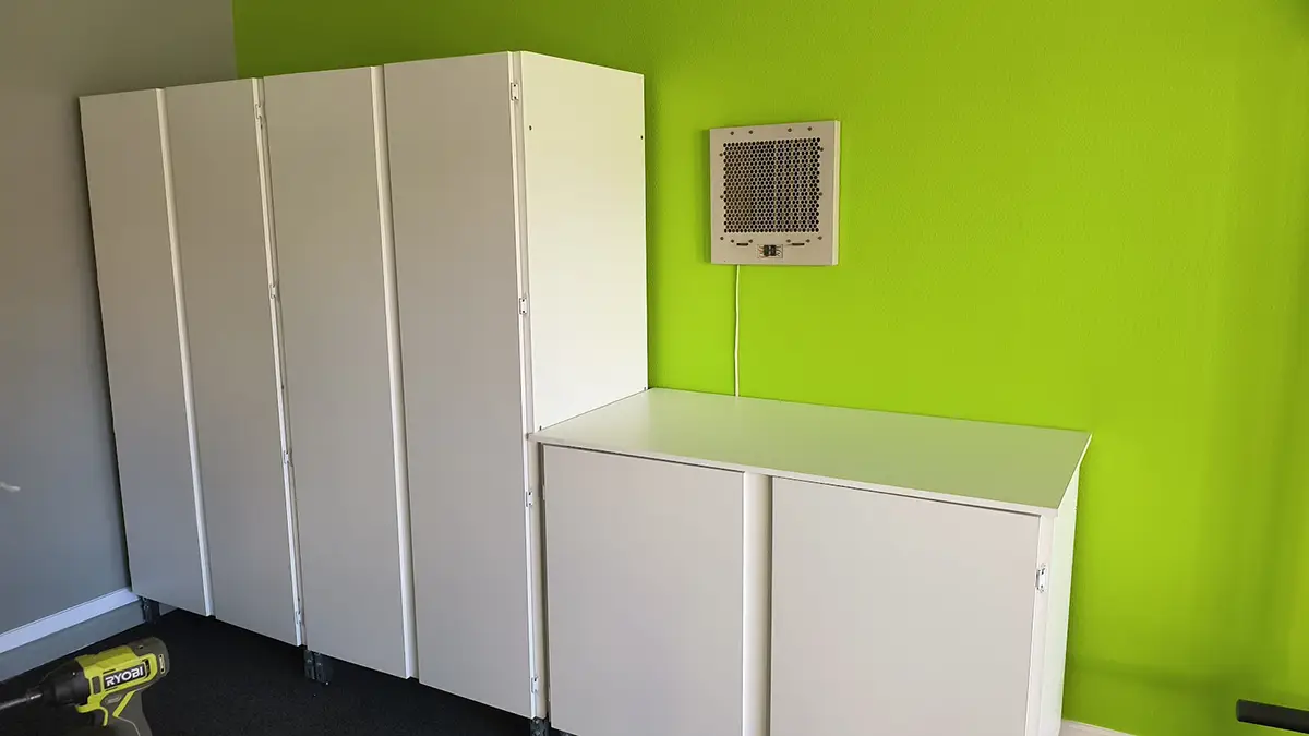 white cabinets with workbench